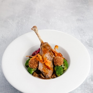 Slow cooked duck leg - duck and sloe gin bon bons, braised red cabbage, broccoli and a rich lentil cassoulet