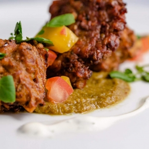 Onion Bhaji - Lentil fritters, dhal, coriander & lime yoghurt with tomato concasse