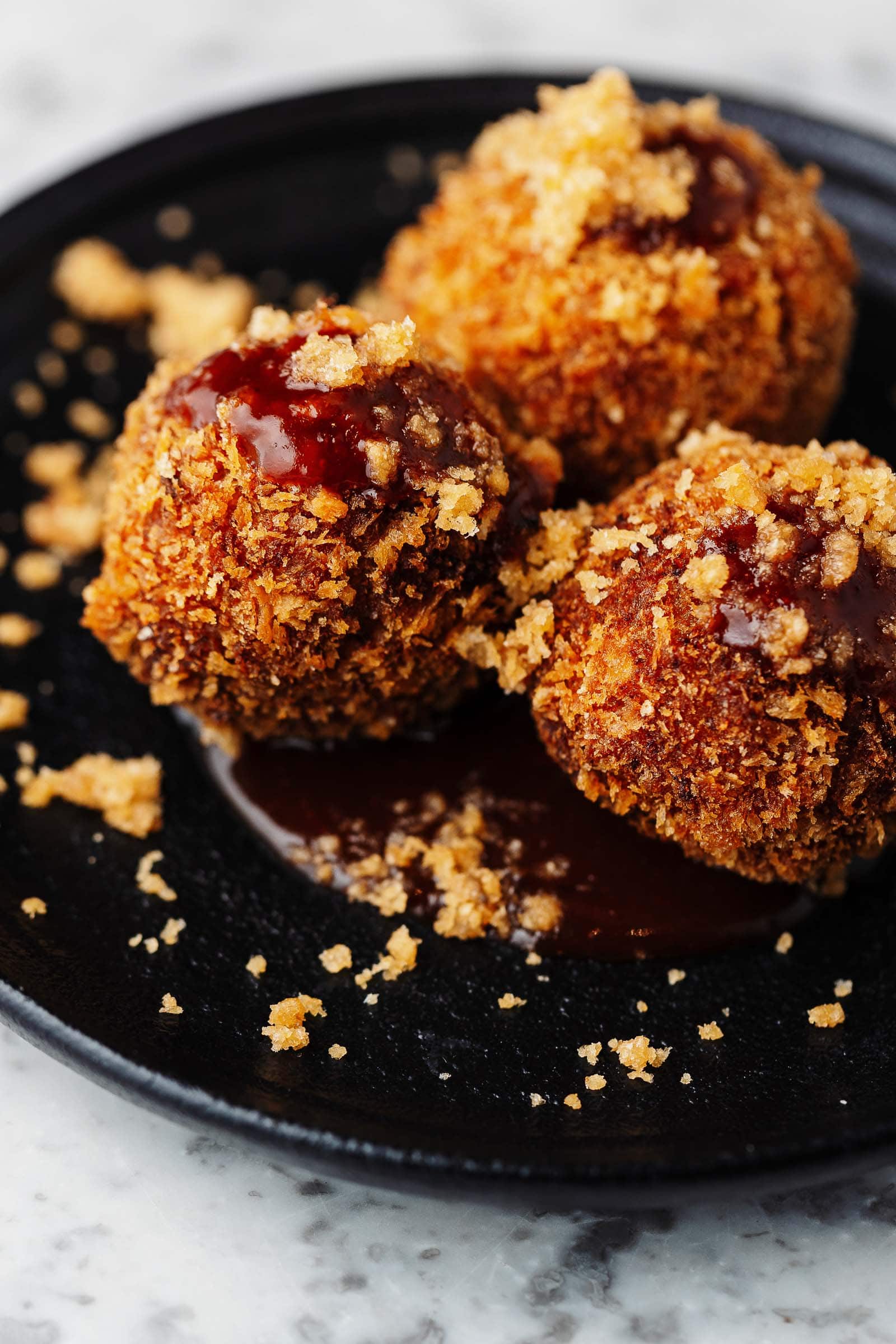 Restaurant photography - pulled pork fried balls topped with bbq sauce