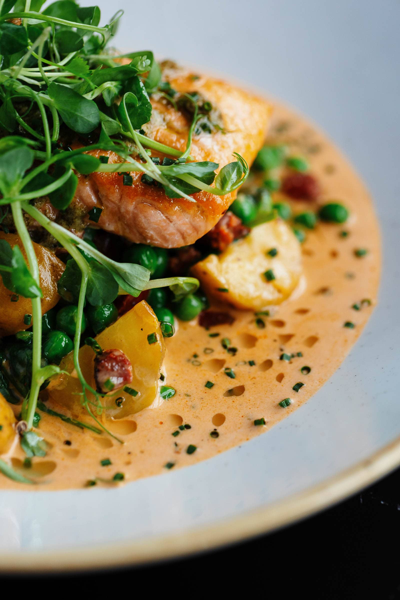 Baked salmon on a peppercorn sauce with potatoes
