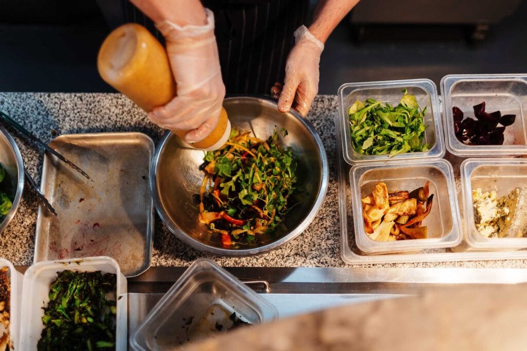 Freshly prepared salads and food ingredients at a Rutland food photography shoot, showcasing vibrant vegetables and artistic food presentation for a professional culinary portfolio.