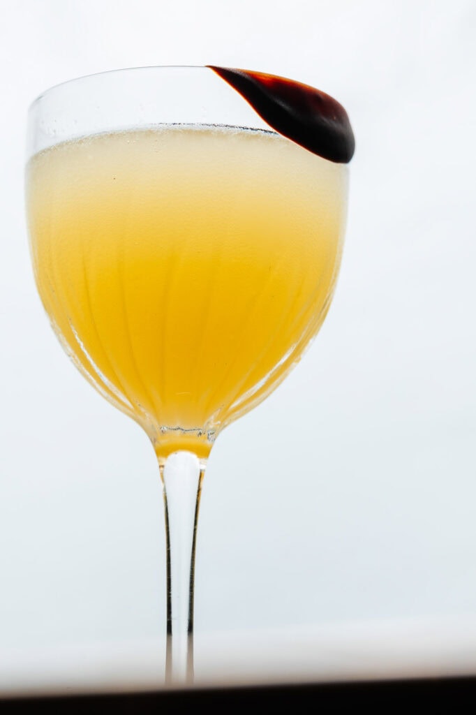 Fresh cocktail with a dark cherry garnish, shot in Rutland, showcasing professional food and drink photography. Perfect for enhancing food blog and restaurant menu visuals.