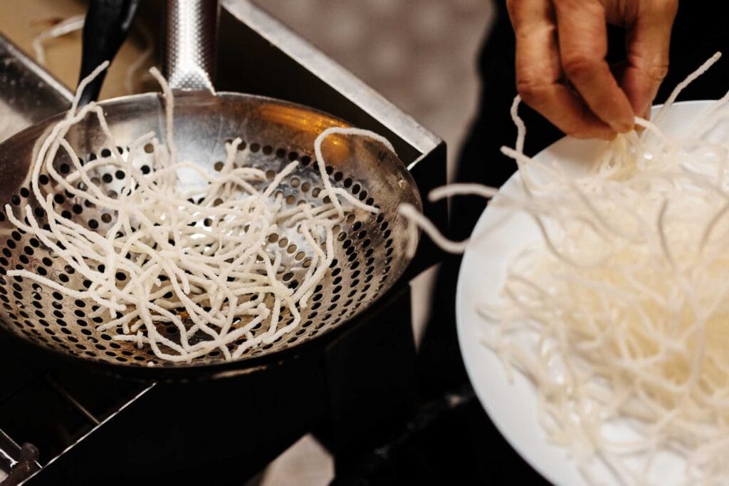 Delicate rice noodles are showcased in this high-quality image, highlighting their texture and freshness, perfect for food photography in the Rutland area.