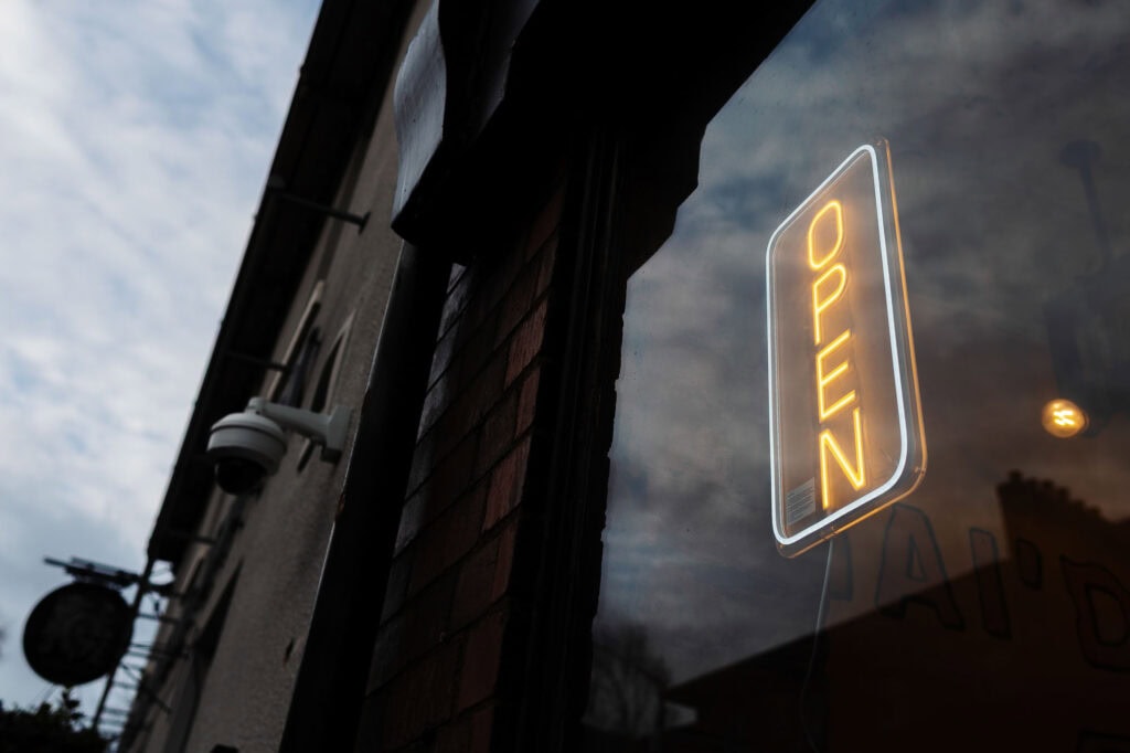 Open neon sign outside a restaurant in Rutland.