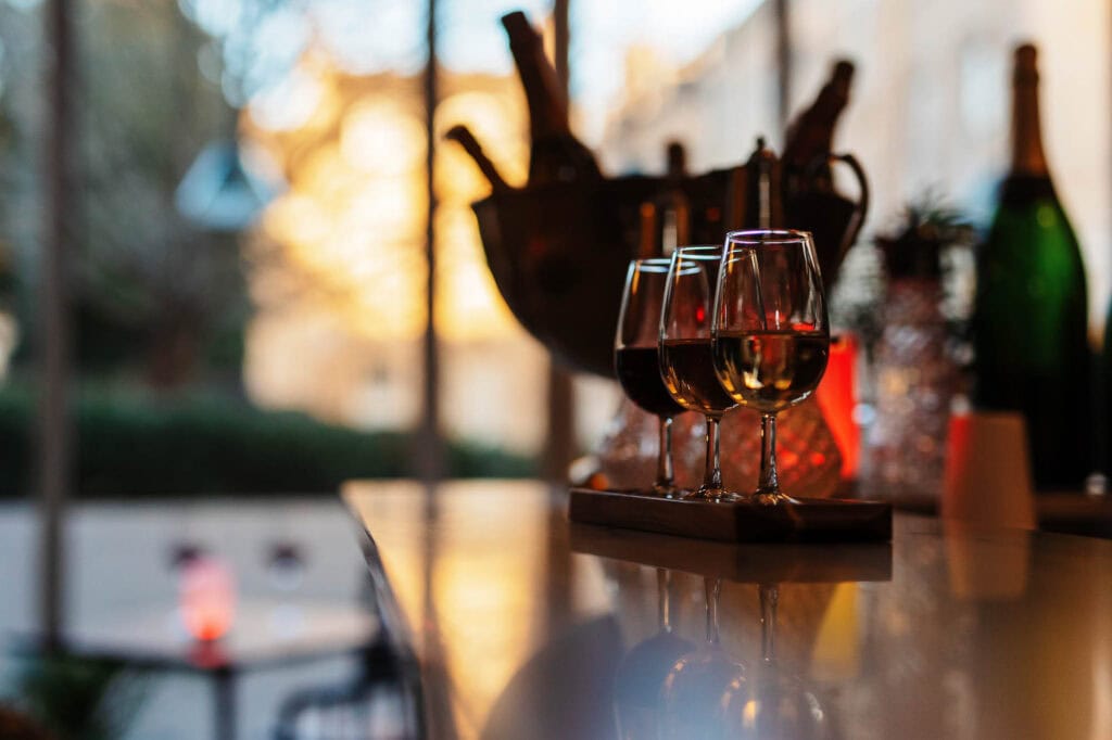 Delicious red wine served in three glasses, captured in a professional food photography style by Rutland Food Photographer, highlighting the rich colour and inviting atmosphere.