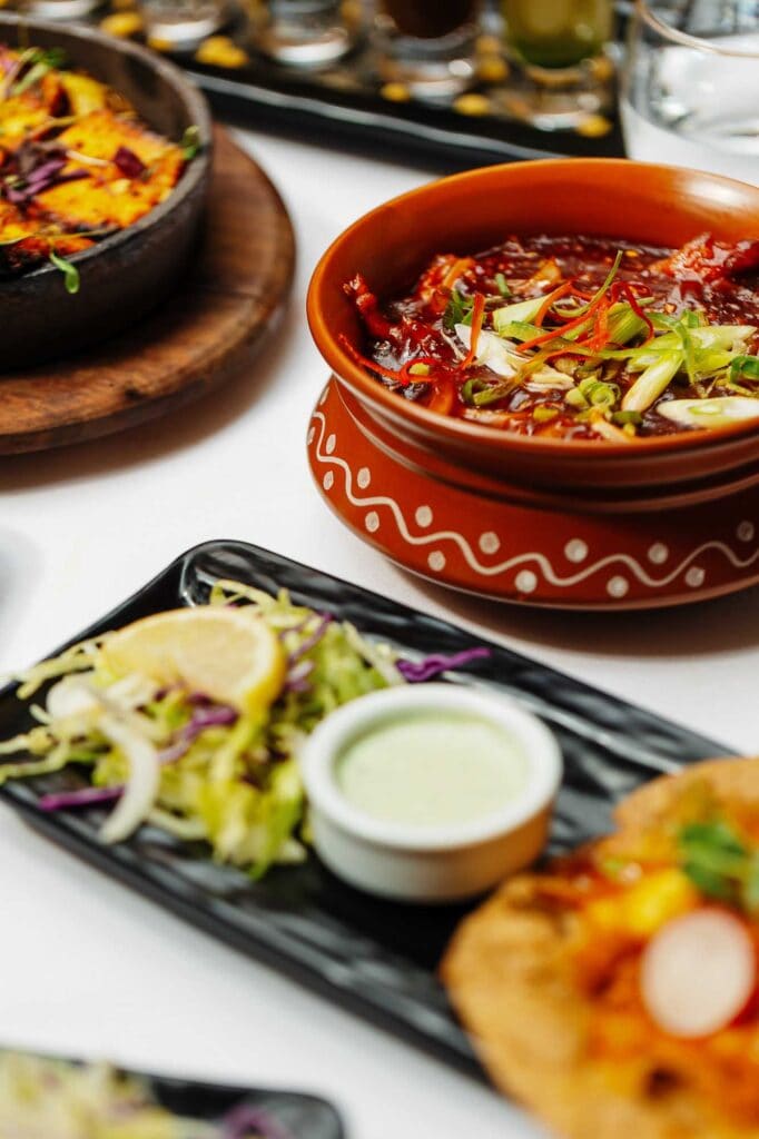 Authentic Indian cuisine served in a traditional clay pot, featuring rich spices, fresh herbs, and vibrant ingredients, perfect for a memorable dining experience in Oakham.