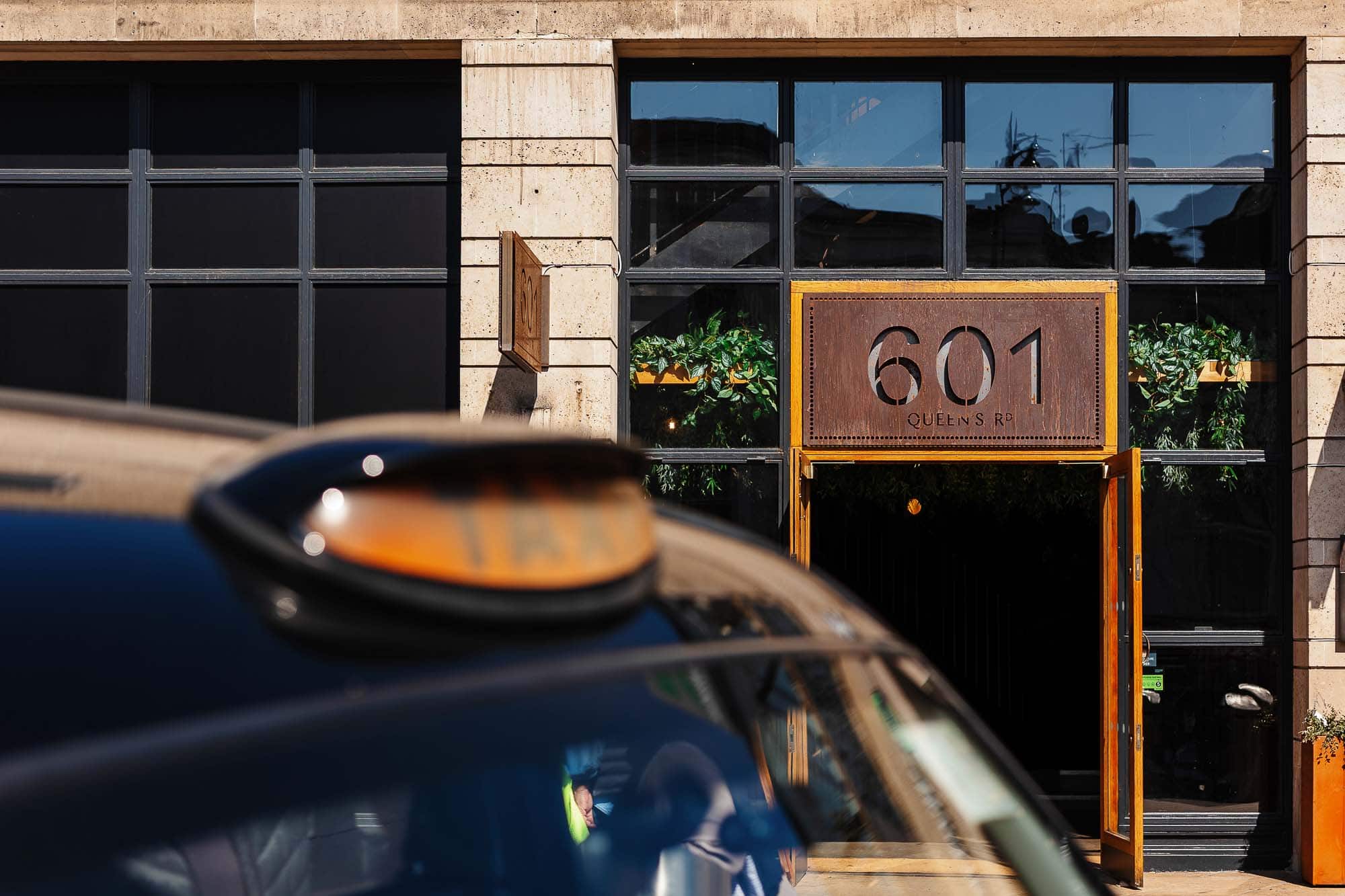 Professional food photography exterior shot of Rutland restaurant at 601 Queens Road, showcasing inviting entrance and greenery, ideal for restaurant marketing and food branding.